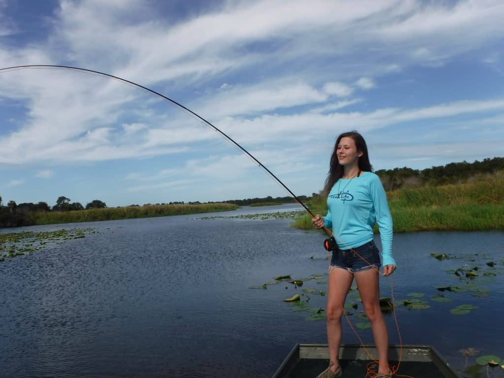 Image of woman fly fishing